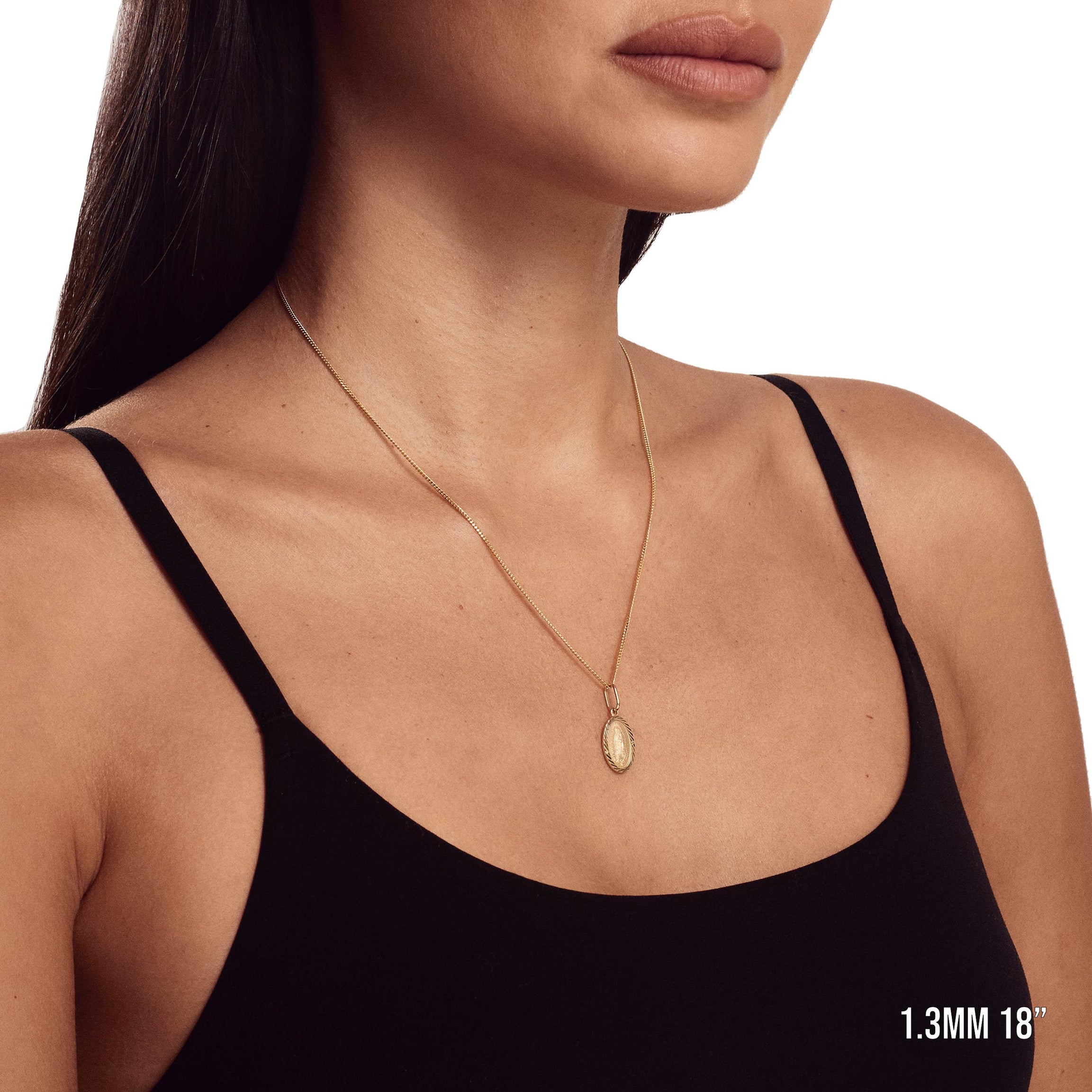 Model wearing 1.3mm 18” mini-cuban chain with listed pendant.
